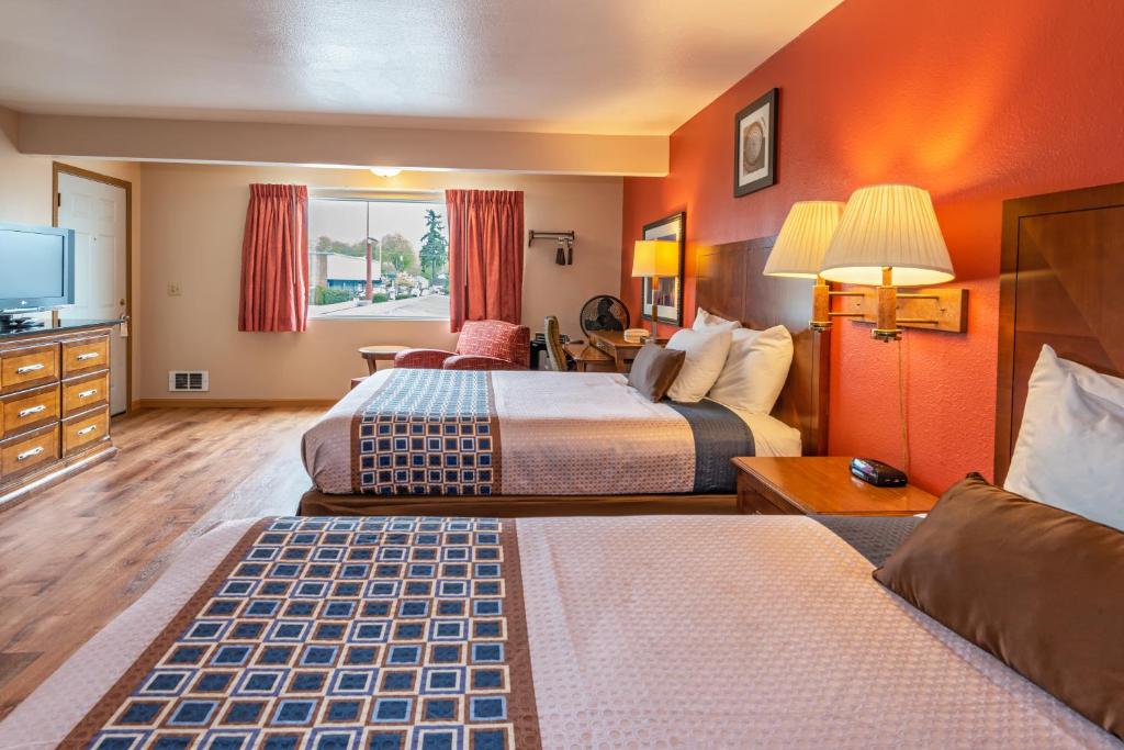 Postel nebo postele na pokoji v ubytování Flagstone Motel