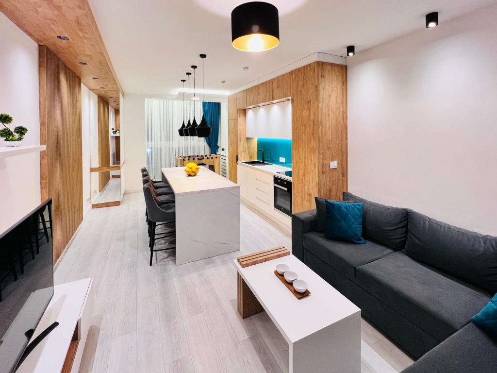 a living room with a couch and a table at Vivio 2 Luxury Apartment in Belgrade
