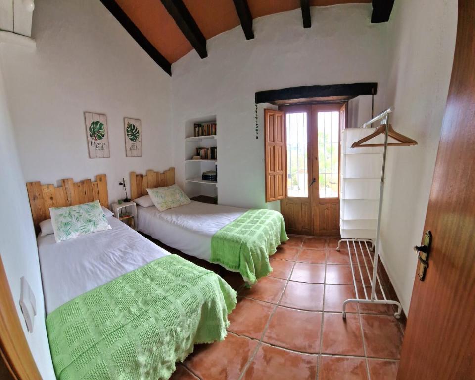 Postel nebo postele na pokoji v ubytování Villa Botero