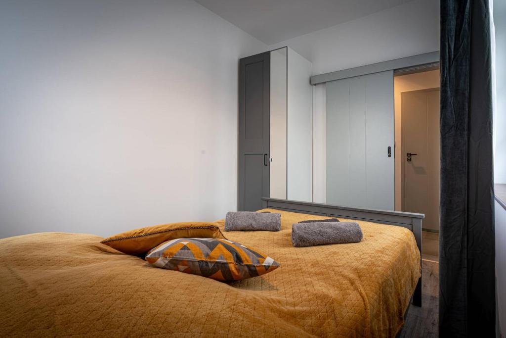Posteľ alebo postele v izbe v ubytovaní Apartamenty Ustronne Liściasta