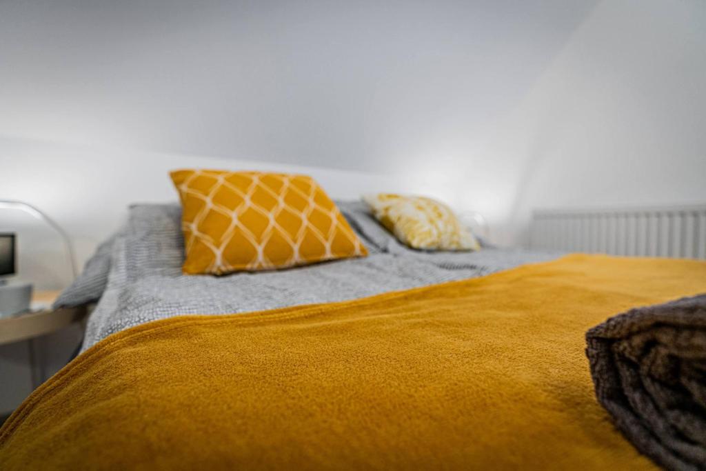 Posteľ alebo postele v izbe v ubytovaní Apartamenty Ustronne Liściasta