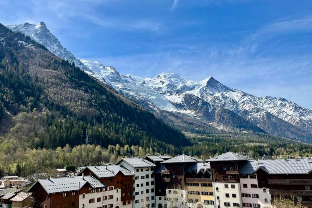 a town in the mountains with snow covered mountains at Apartment Of 55 M With Balcony View Mont Blanc in Chamonix