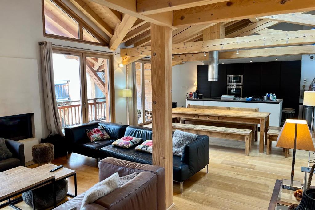 a living room with a couch and a table at Chalet Of 235 M2 With Balcony Garden In Chamonix in Chamonix