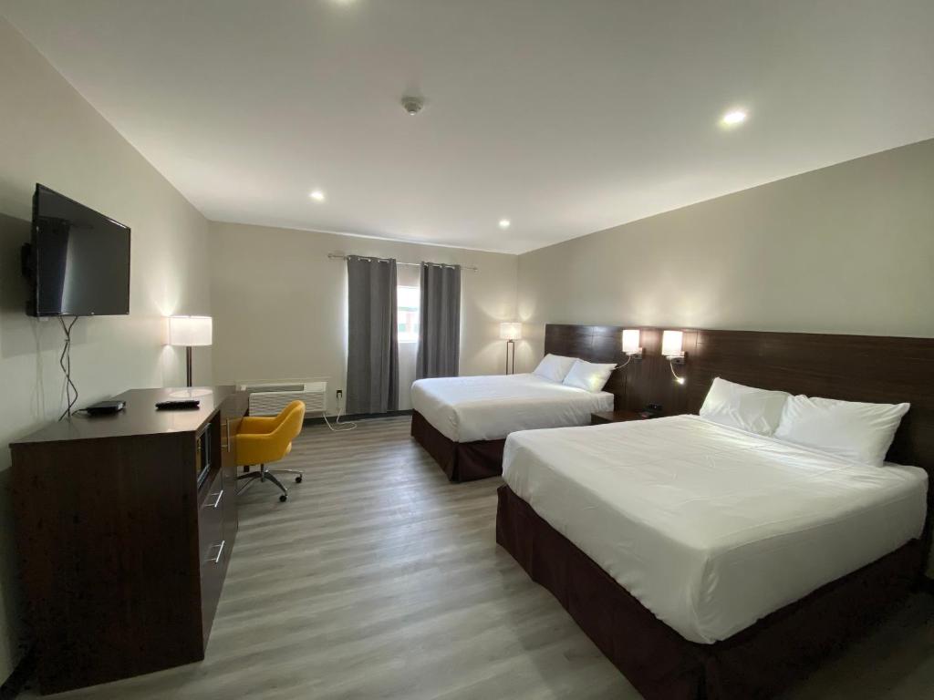 Postel nebo postele na pokoji v ubytování Econo Lodge