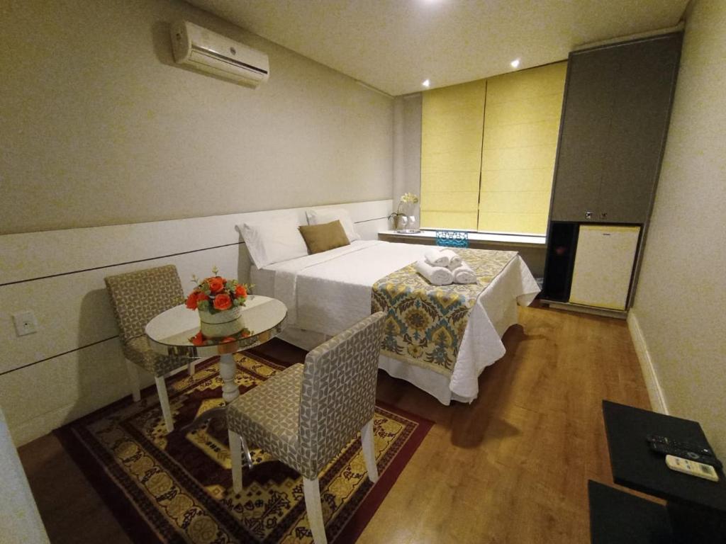 Postel nebo postele na pokoji v ubytování Caetité Palace Hotel