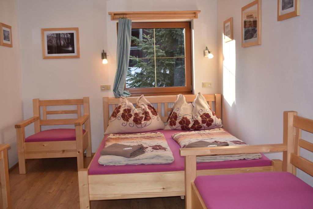 Postel nebo postele na pokoji v ubytování Penzion U Jelena