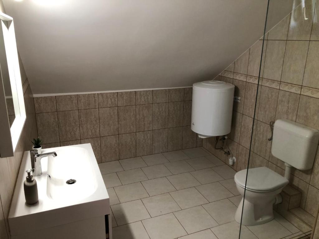Kúpeľňa v ubytovaní Hélium Apartman