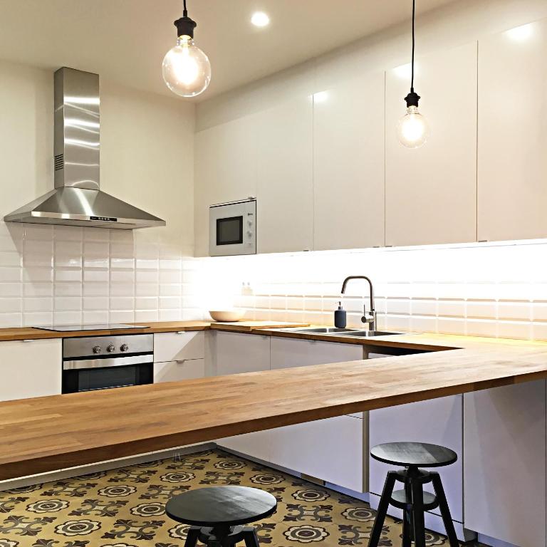 A kitchen or kitchenette at L'ANTIGA