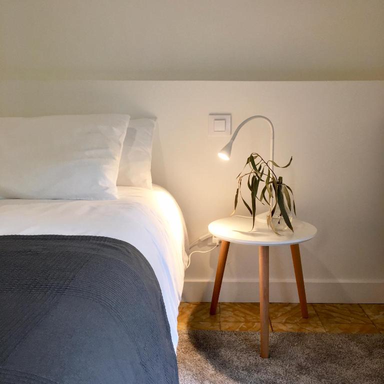 A bed or beds in a room at L'ANTIGA