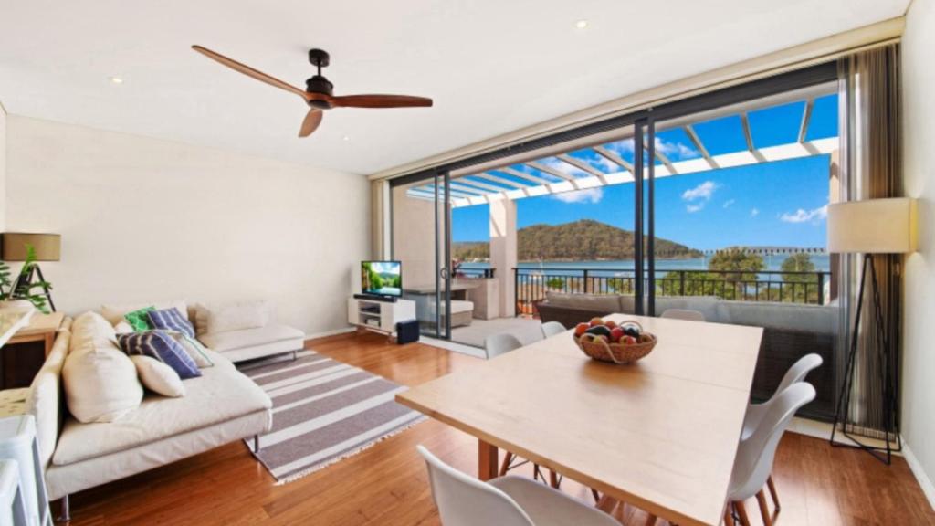 a living room with a view of the ocean at Sea View - Ettalong Beach in Ettalong Beach
