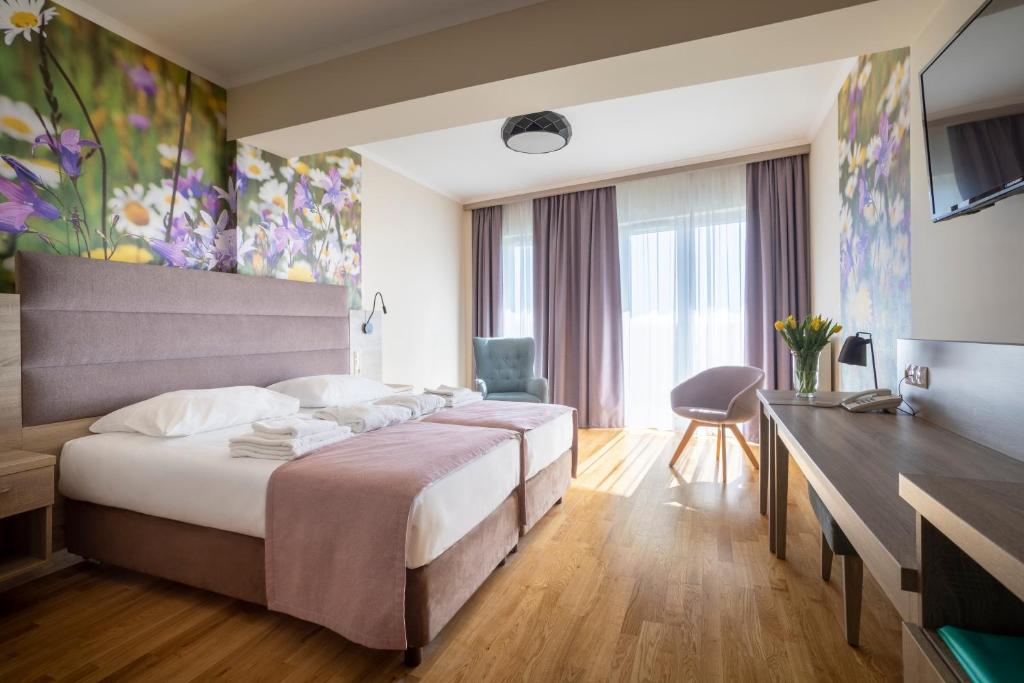 Posteľ alebo postele v izbe v ubytovaní Terma Słowacki Resort Medical Spa