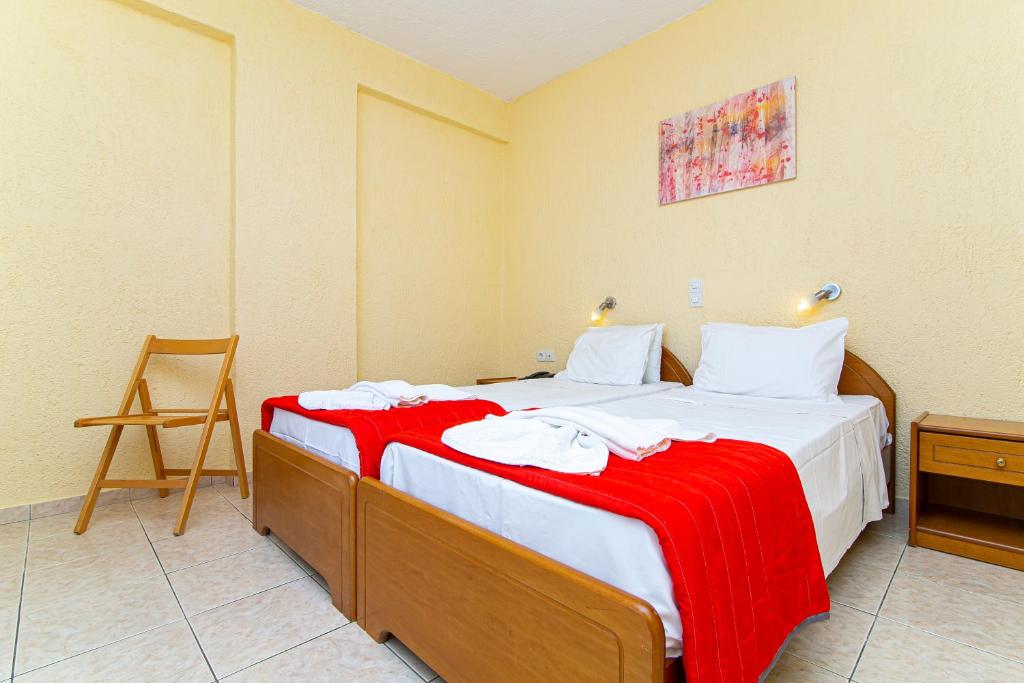 Postel nebo postele na pokoji v ubytování Triton Hotel