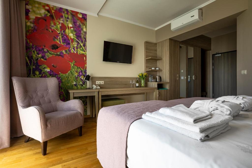 Televízia a/alebo spoločenská miestnosť v ubytovaní Terma Słowacki Resort Medical Spa
