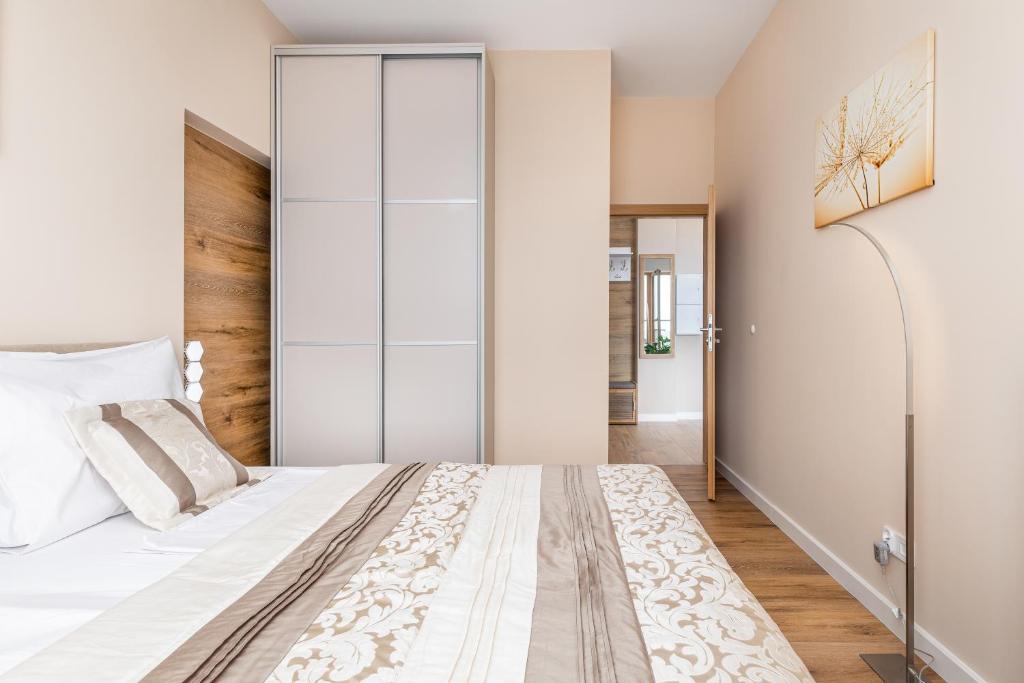 Posteľ alebo postele v izbe v ubytovaní Platan Tower Baltic & More Apartments