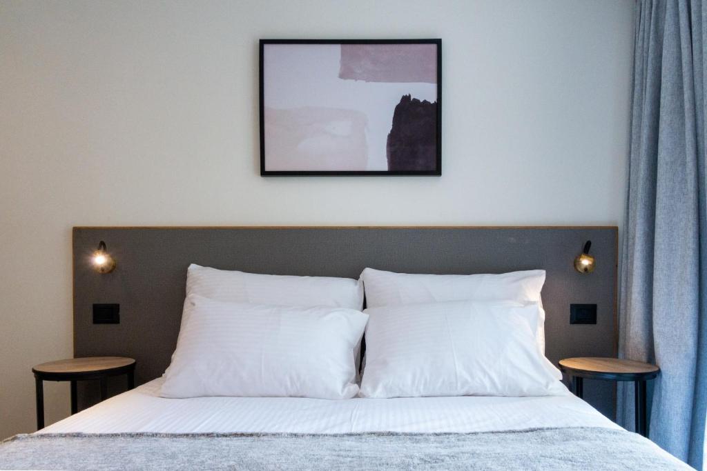 Postel nebo postele na pokoji v ubytování Urbanic Hotel