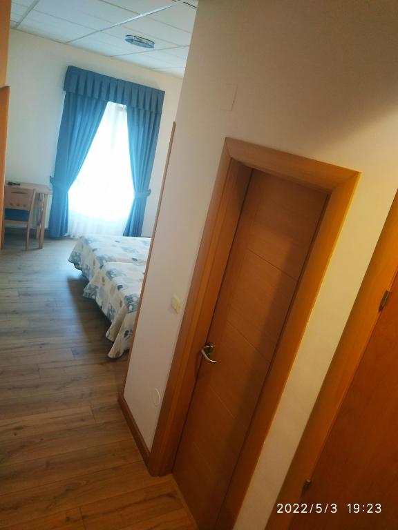Postel nebo postele na pokoji v ubytování Hotel La Guindal