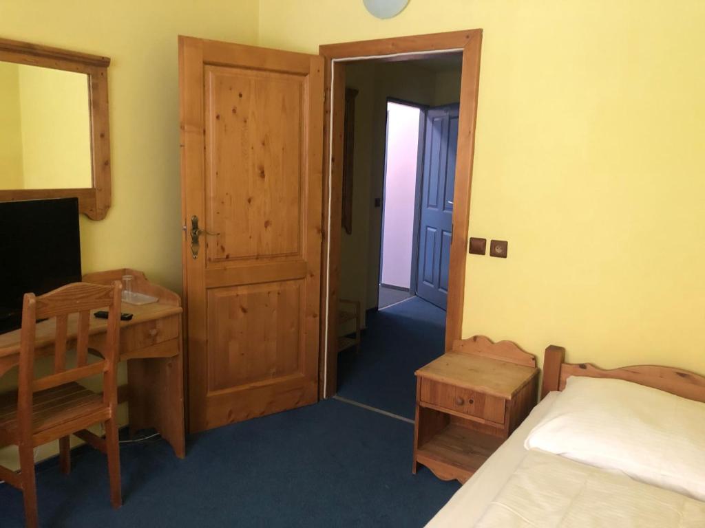 Postel nebo postele na pokoji v ubytování Hotel Ondras z Beskyd