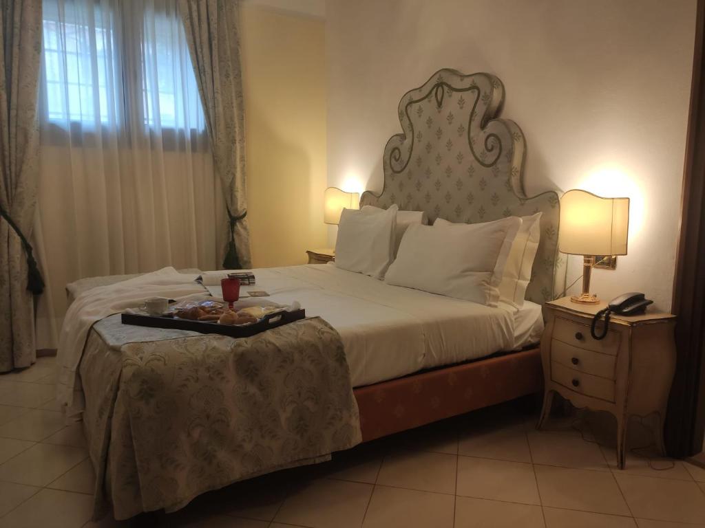 A bed or beds in a room at Ca' Vendramin Zago