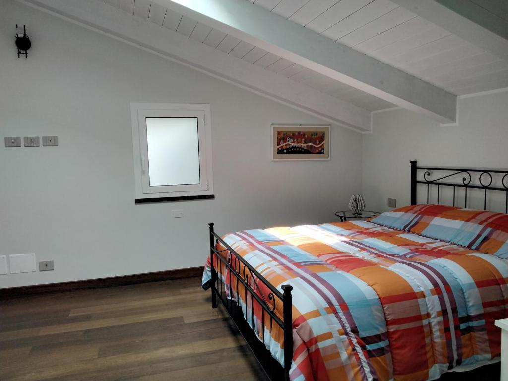 Posteľ alebo postele v izbe v ubytovaní "Vento di Levante Suite" benvenuti in collina