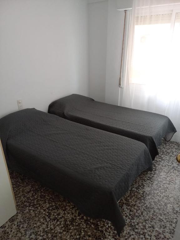 Posteľ alebo postele v izbe v ubytovaní COSTA DAURADA APARTAMENTS - Molins II