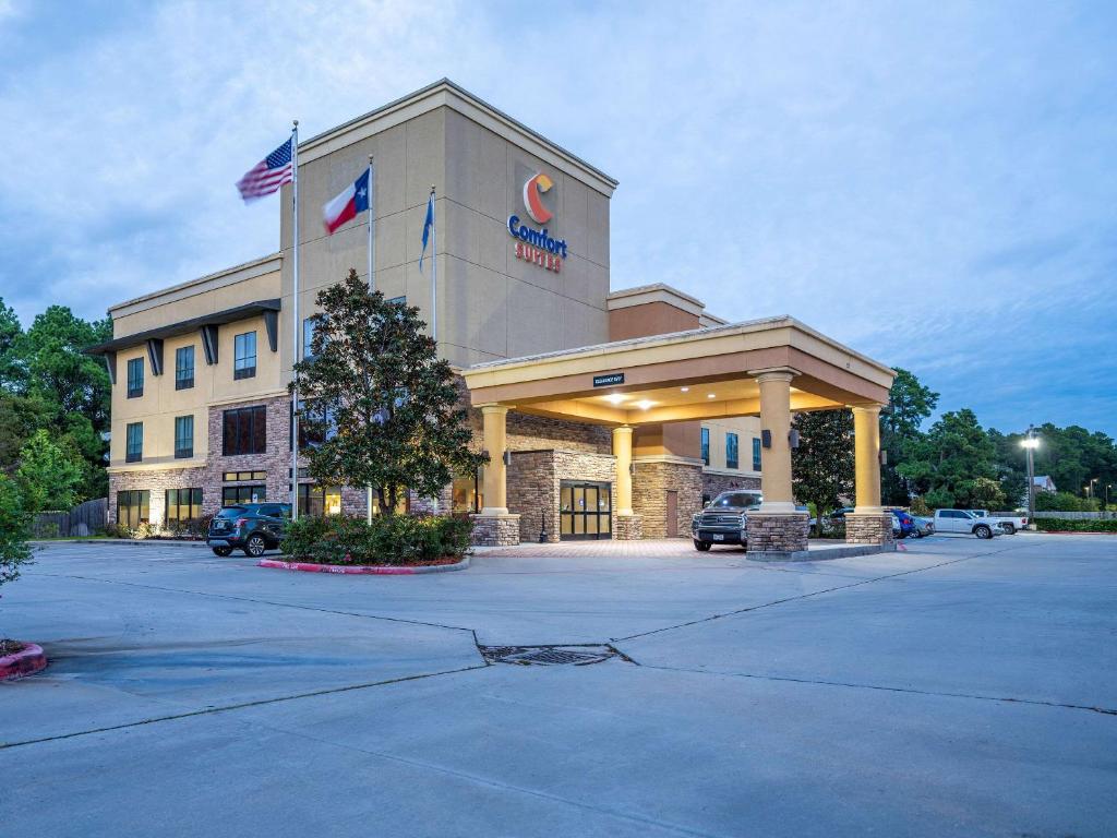 a store front of a hotel with a parking lot at Comfort Suites Old Town Spring in Spring