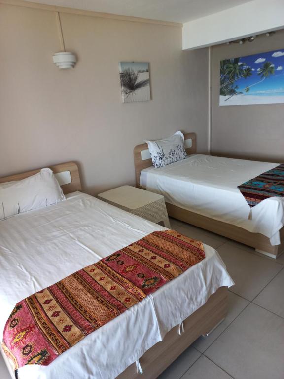 Postel nebo postele na pokoji v ubytování Villas Vetiver