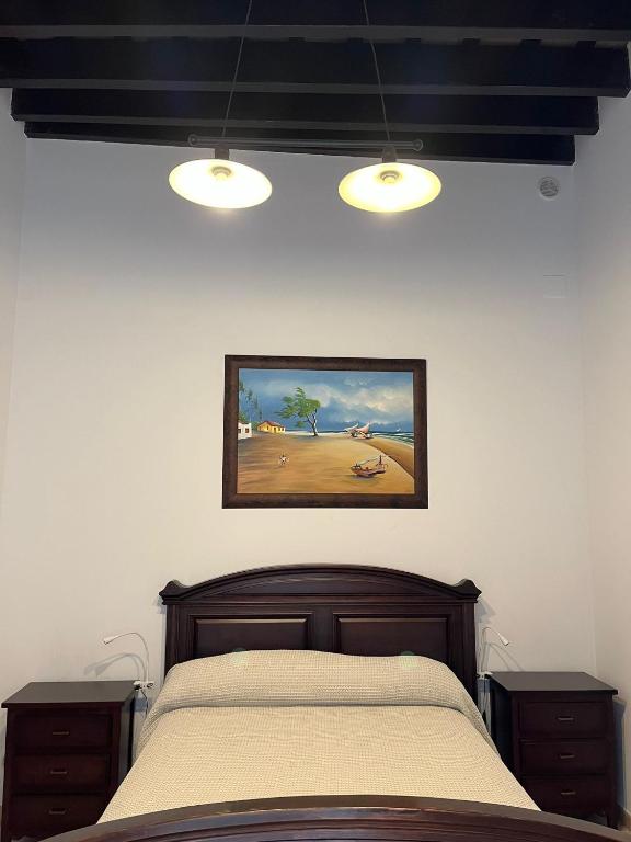 Łóżko lub łóżka w pokoju w obiekcie Casa Ribera Centro