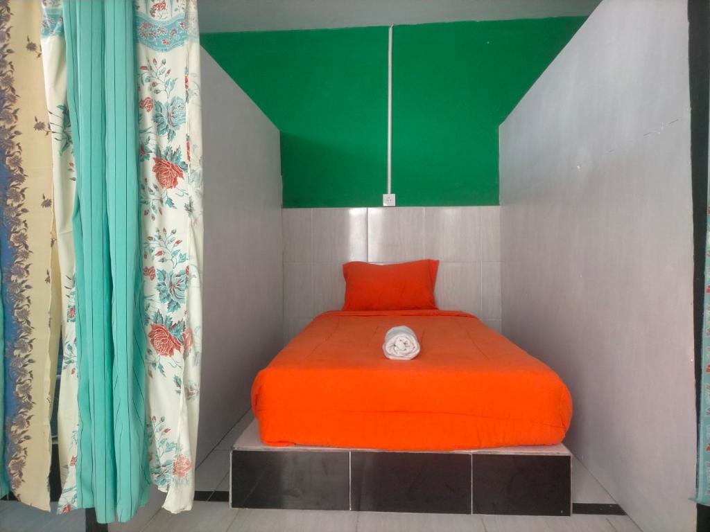 Postel nebo postele na pokoji v ubytování Dragonfly Hostel and Homestay