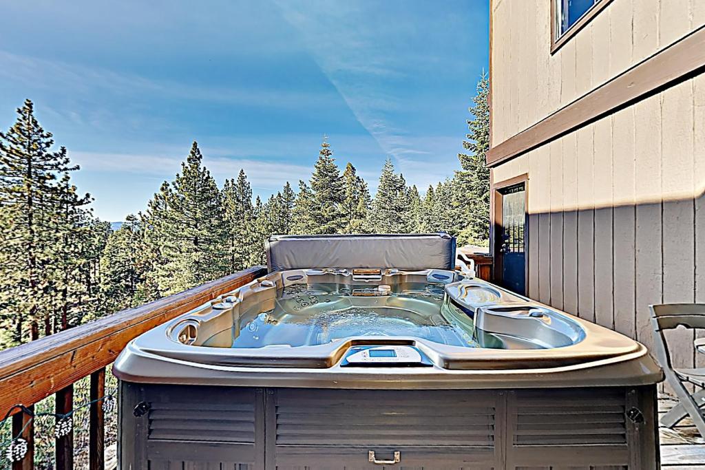 a hot tub on the balcony of a house at Chalet Court Manor in Zephyr Cove