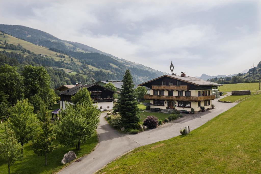 an aerial view of a house in the mountains at Ferienwohnung 2 in Taxenbach