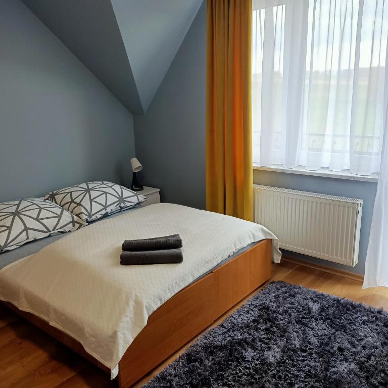 Postel nebo postele na pokoji v ubytování Willa Różana