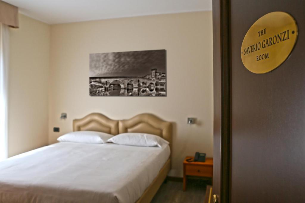 Postel nebo postele na pokoji v ubytování Veronello Resort