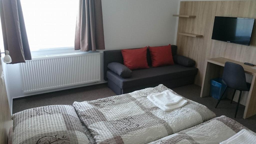 Postel nebo postele na pokoji v ubytování Penzion Skalka