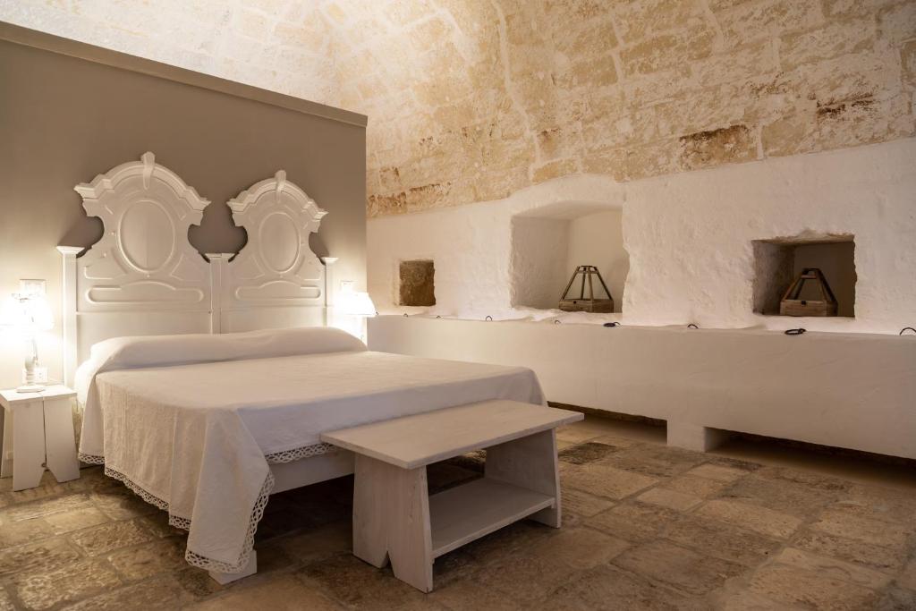 Posteľ alebo postele v izbe v ubytovaní MASSERIA SCALEDDA