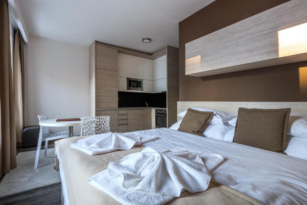 Postel nebo postele na pokoji v ubytování HOTEL PECR WELL