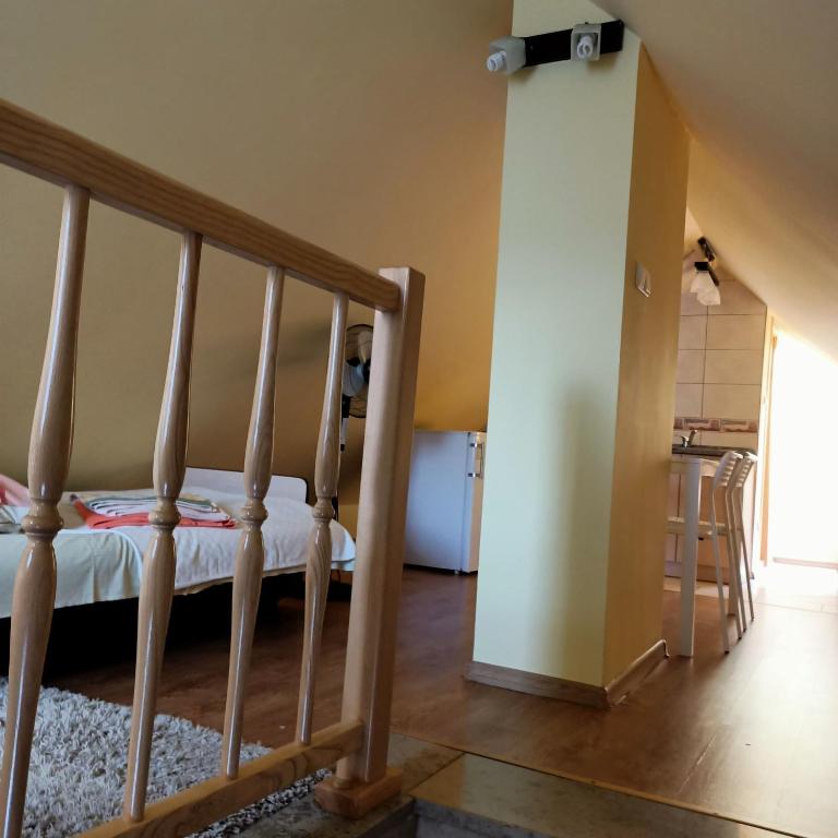 Postel nebo postele na pokoji v ubytování Willa Różana