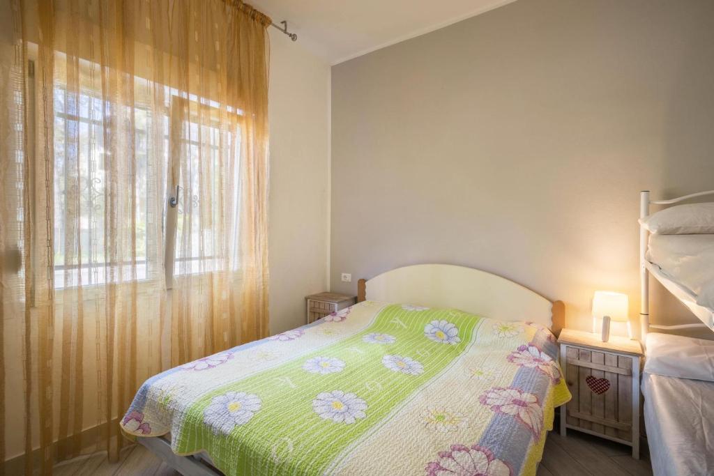 Posteľ alebo postele v izbe v ubytovaní Residenza Maja 2