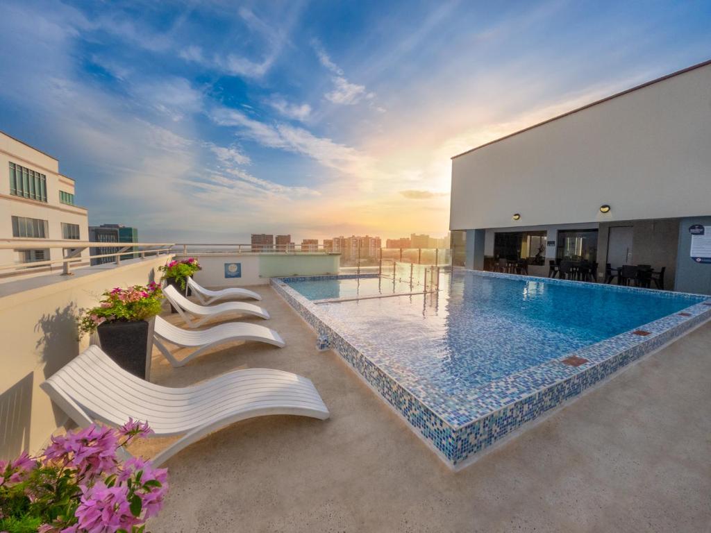 a swimming pool on the roof of a building at GHL Hotel Barranquilla in Barranquilla