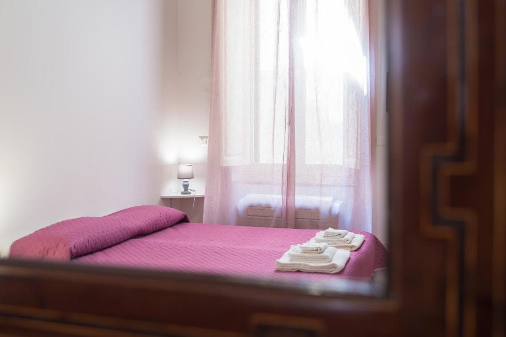 Postel nebo postele na pokoji v ubytování Palau Marco Polo