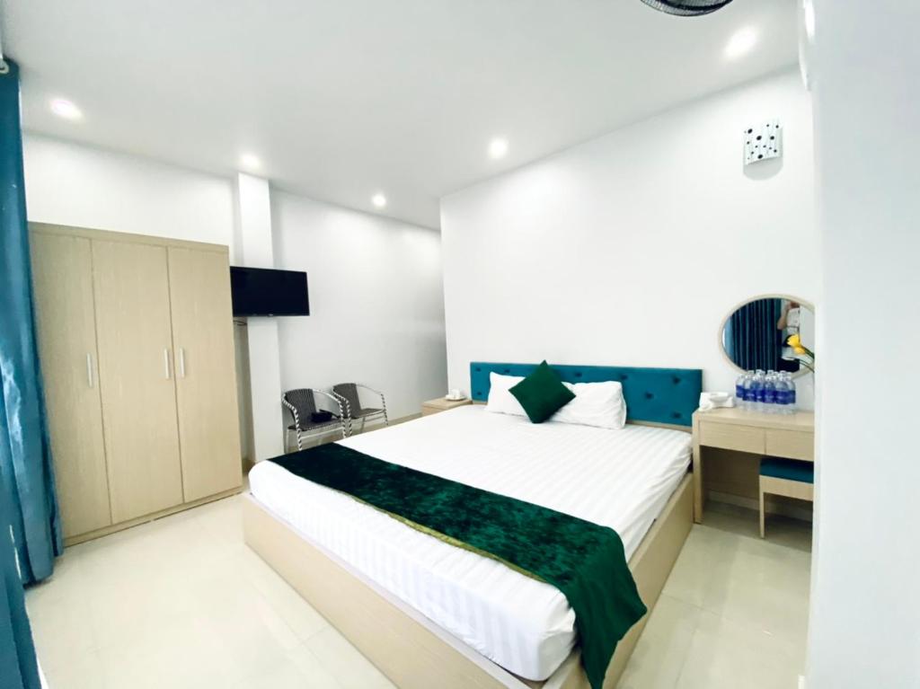 Giường trong phòng chung tại Ngoc Ha Hotel