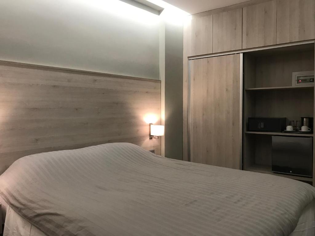 Postel nebo postele na pokoji v ubytování Plaza Hotel