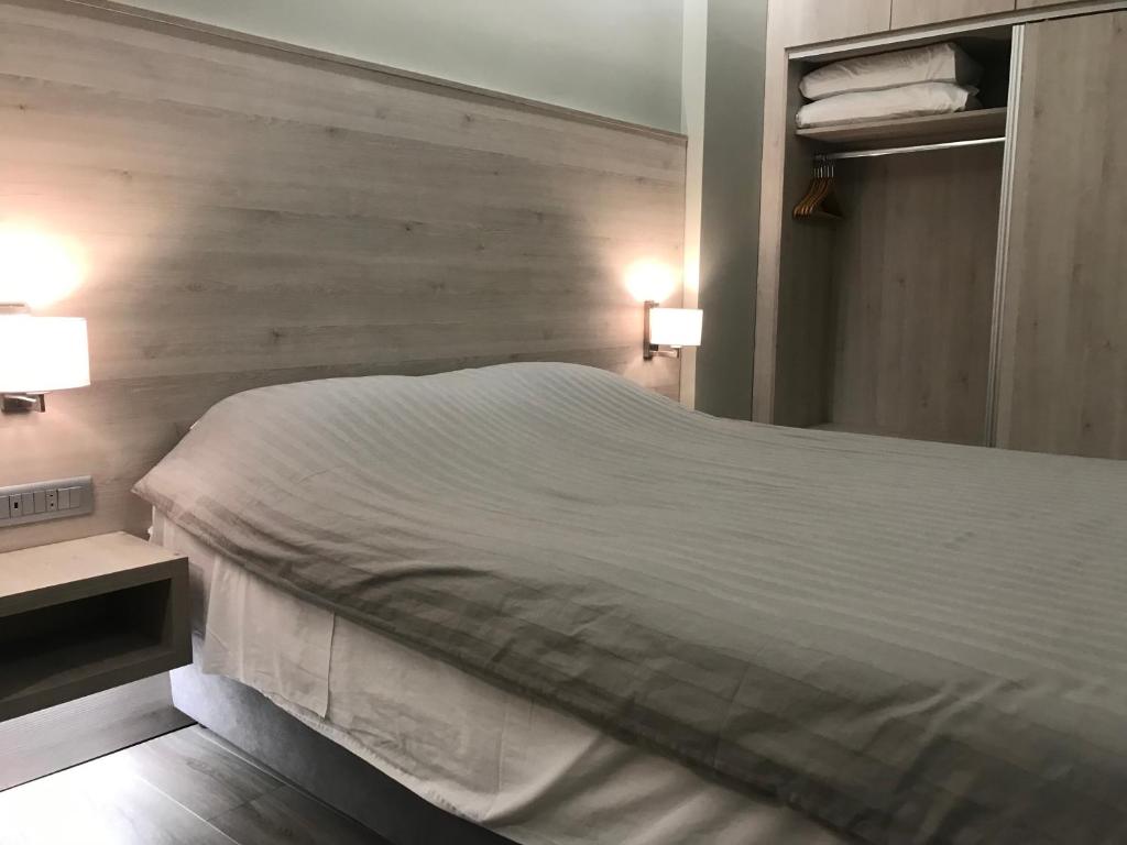 Postel nebo postele na pokoji v ubytování Plaza Hotel