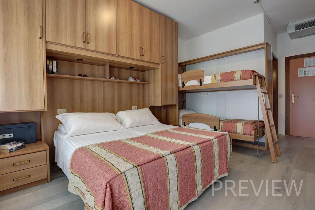 Postel nebo postele na pokoji v ubytování Hotel Picobello Pineta