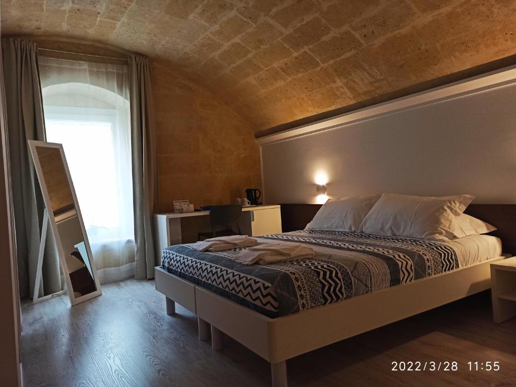 Postel nebo postele na pokoji v ubytování In & Out Matera