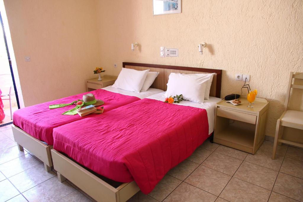 Postel nebo postele na pokoji v ubytování Triton Hotel