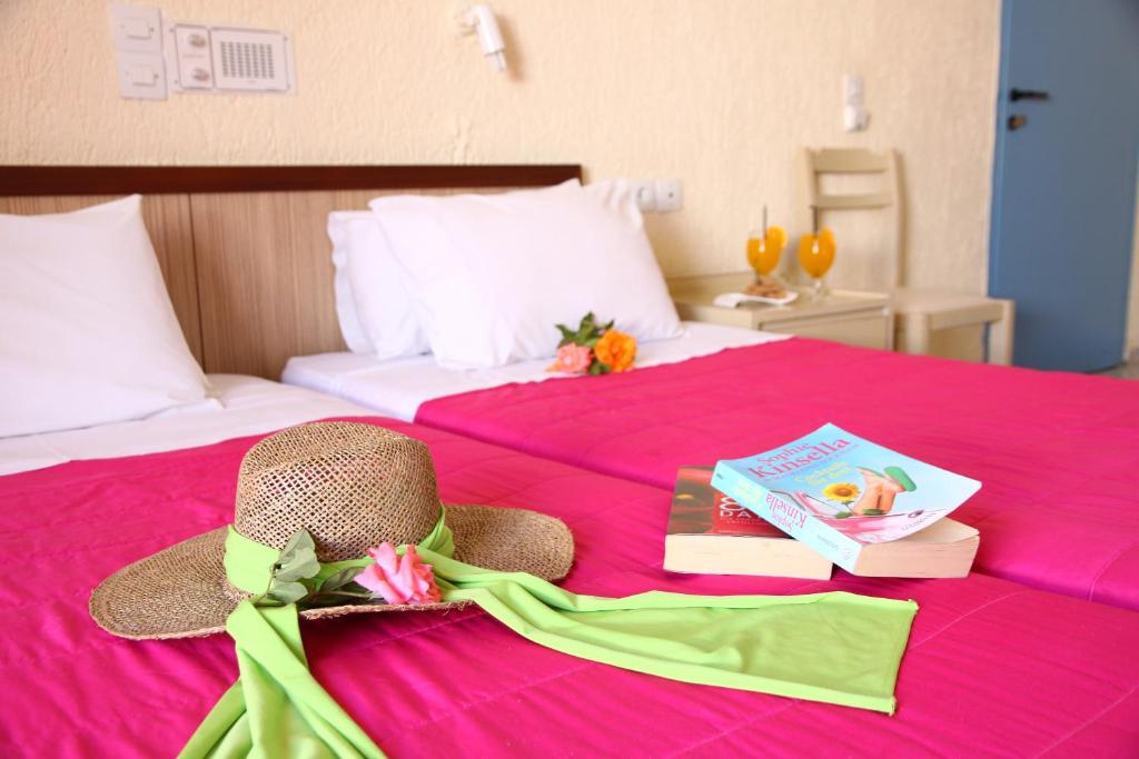 Postel nebo postele na pokoji v ubytování Triton Hotel