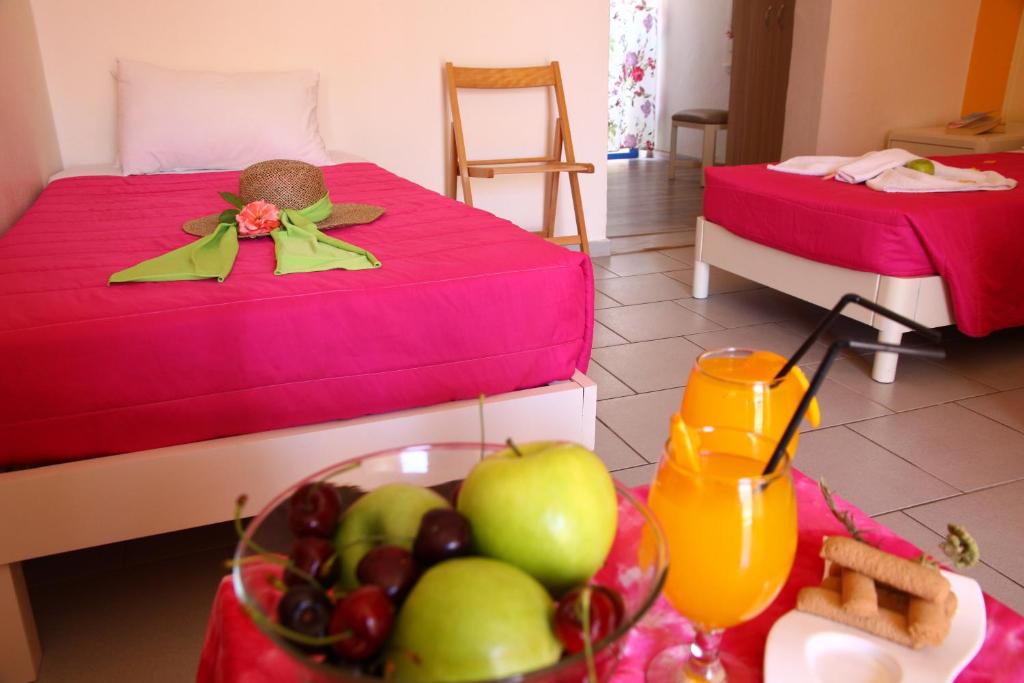 Postel nebo postele na pokoji v ubytování Triton Hotel