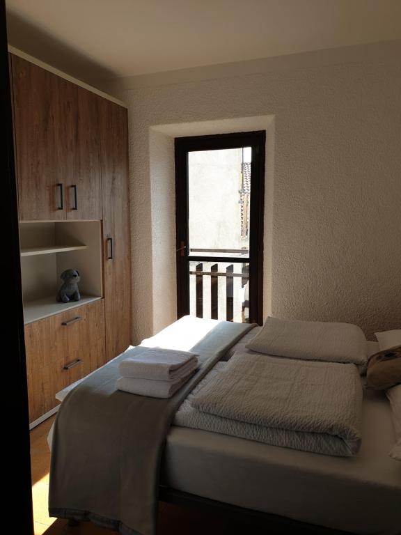 A bed or beds in a room at bb26 apartment mountain Lozio