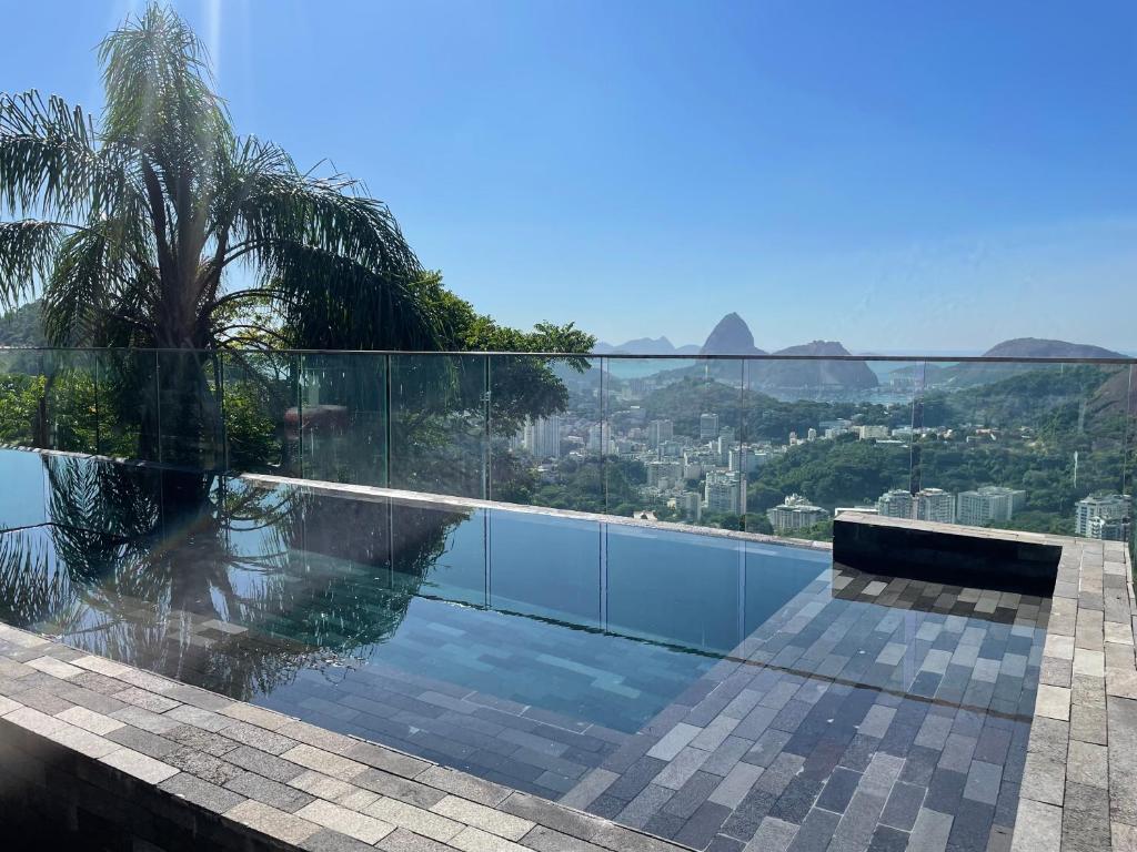 a swimming pool with a view of the city at Pousada Rio144 in Rio de Janeiro