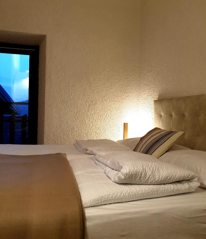 A bed or beds in a room at bb26 apartment mountain Lozio